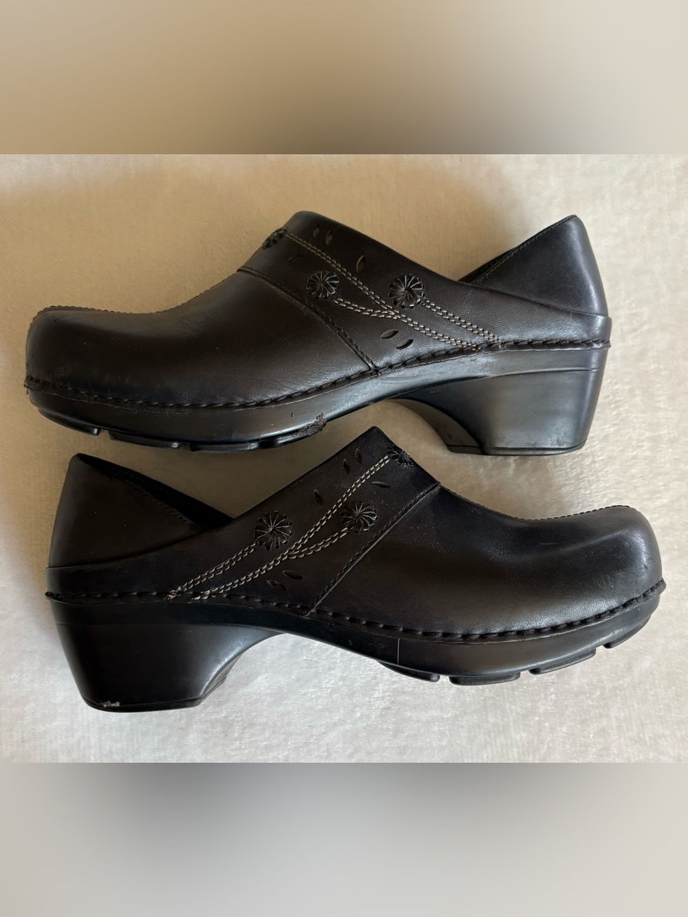 Dansko Black Leather Women’s Slip-On Clogs with Floral Cutouts